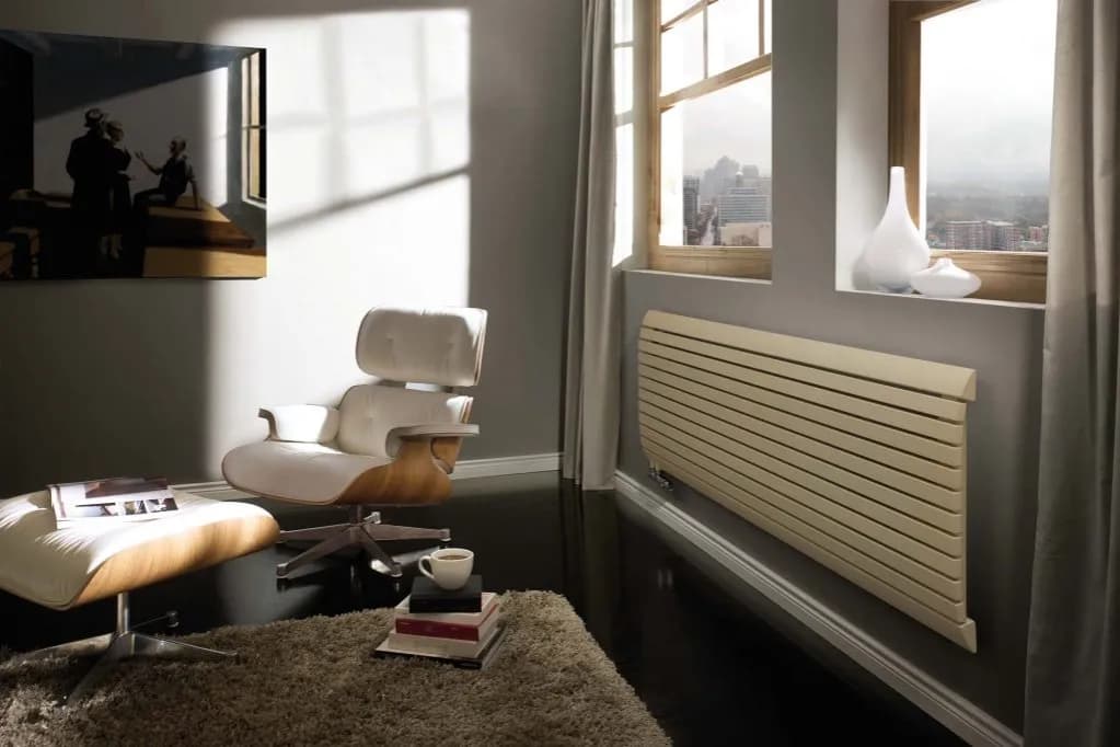 Dlaczego kaloryfery montuje się pod oknem? Odkryj korzyści i zalety